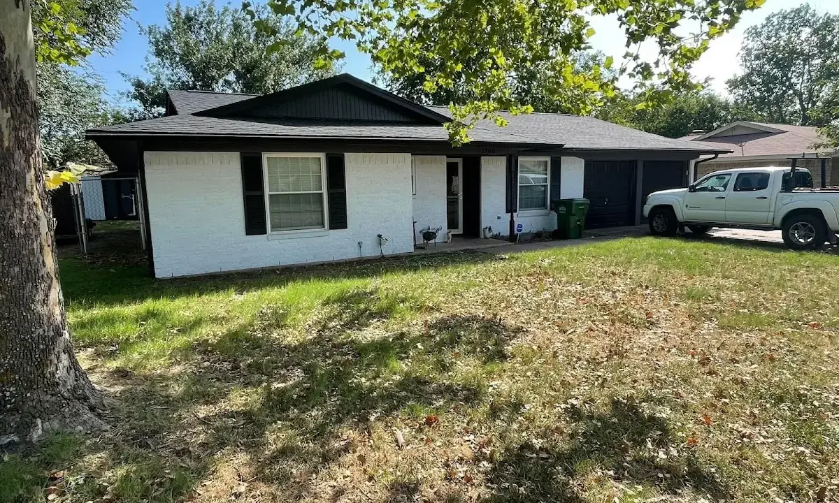 Professional roofing crew working on a residential roof in Somersworth